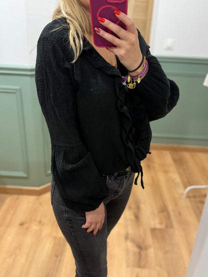 Blouse à volants et lien noué